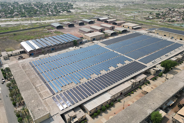 Roof‑mounted solar panels on a Pakistani home